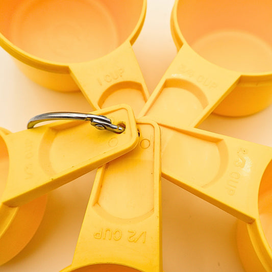 Yellow Tupperware Measuring Cups
