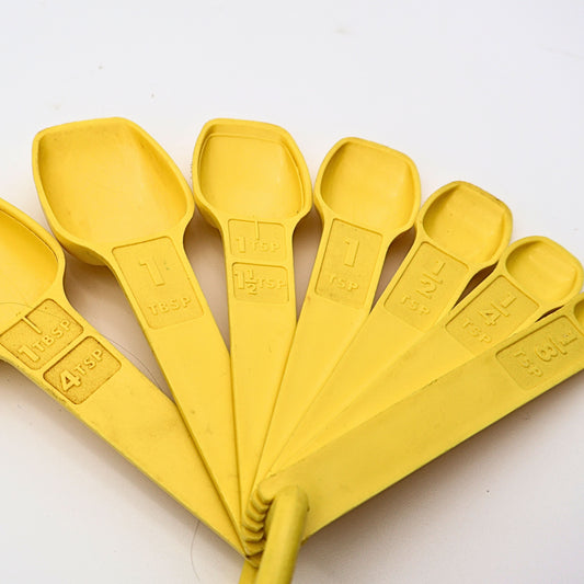 Yellow Tupperware Measuring Spoons