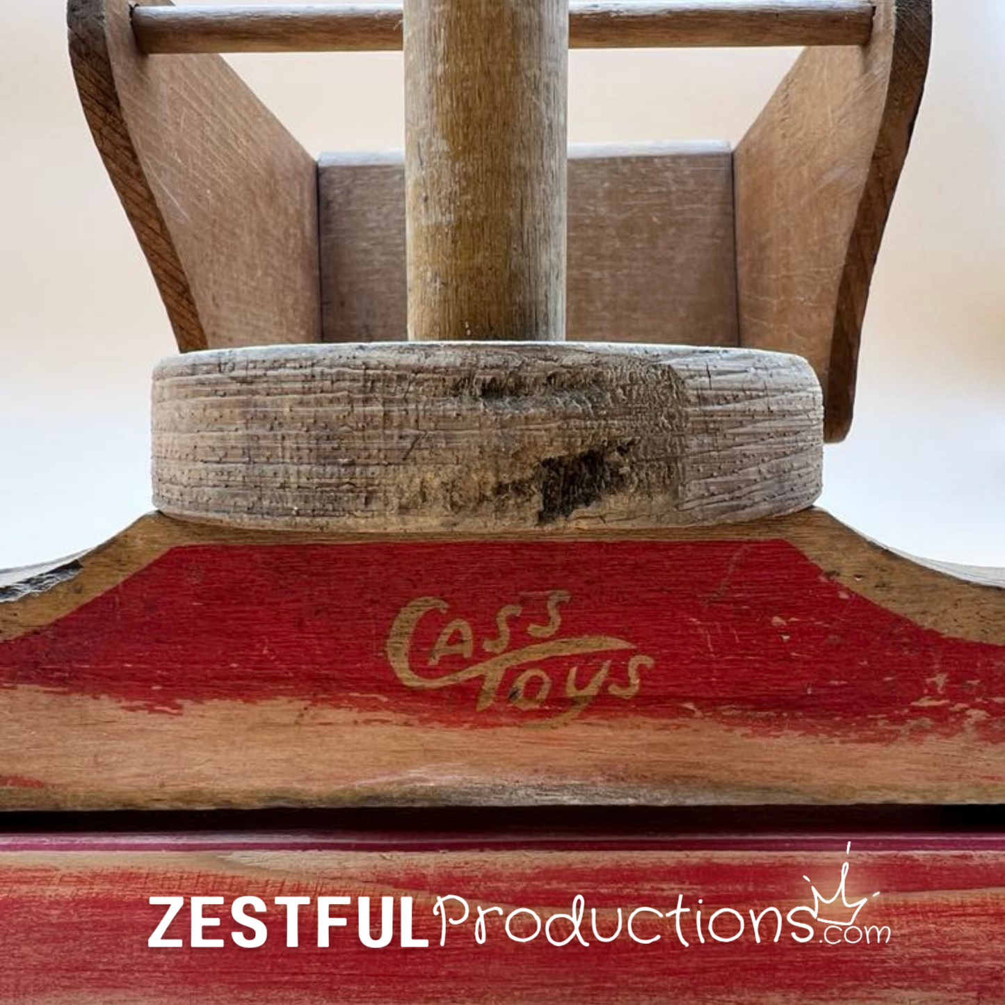 Cass Toys logo on front of vintage wooden doll stroller