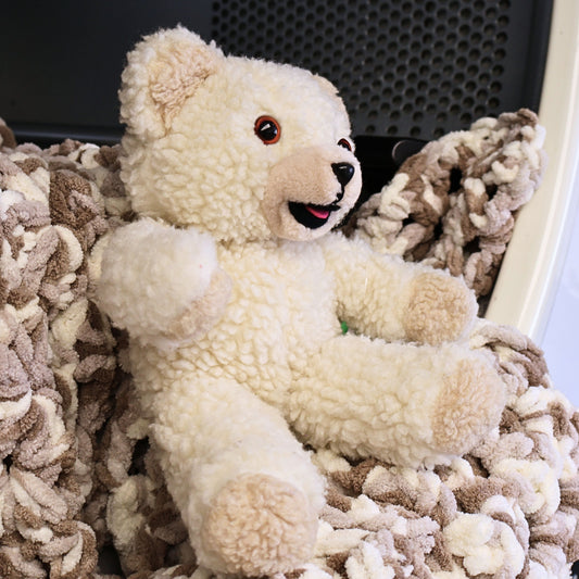 Side view of a vintage Snuggle fabric softener mascot plush showing soft textured fleece, raised arm pose, and classic smiling expression. A nostalgic 1980s advertising collectible perfect for display shelves, vintage toy collections, and lovers of iconic household brand memorabilia.
