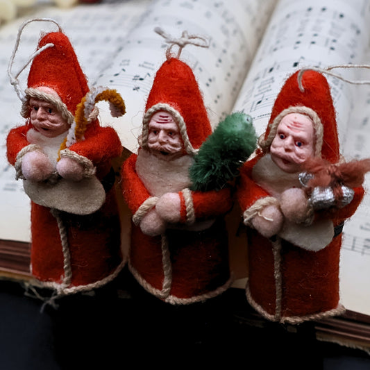 Vintage German Santa ornaments set featuring Belsnickle figures crafted in spun cotton with classic holiday character