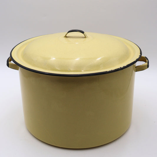 Vintage yellow enamelware stock pot with matching lid featuring a soft buttery yellow finish, black rolled trim, and sturdy side handles. This large farmhouse kitchen pot is perfect for cottagecore decorating, rustic home decor, vintage cookware collections, and timeless kitchen styling.
