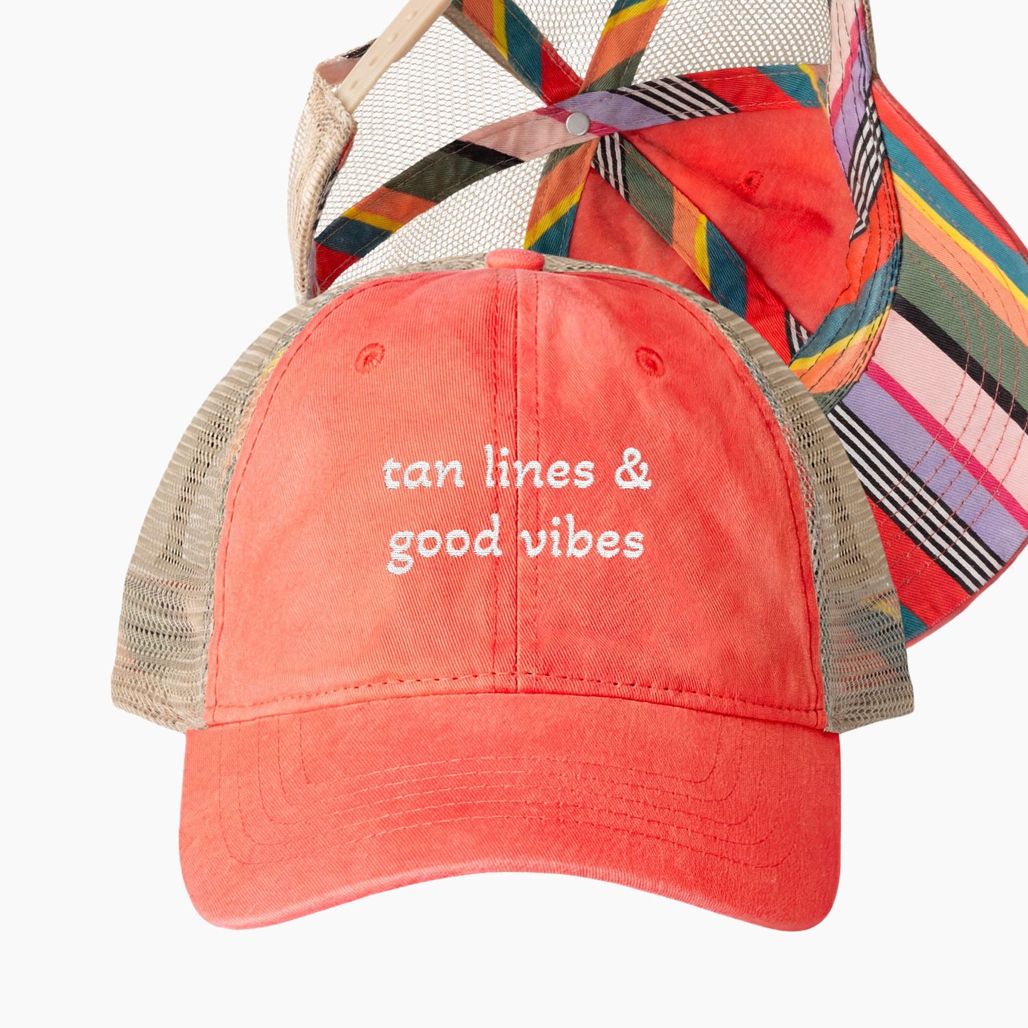 Tan lines and good vibes embroidered coral trucker hat with colorful striped underbrim detail