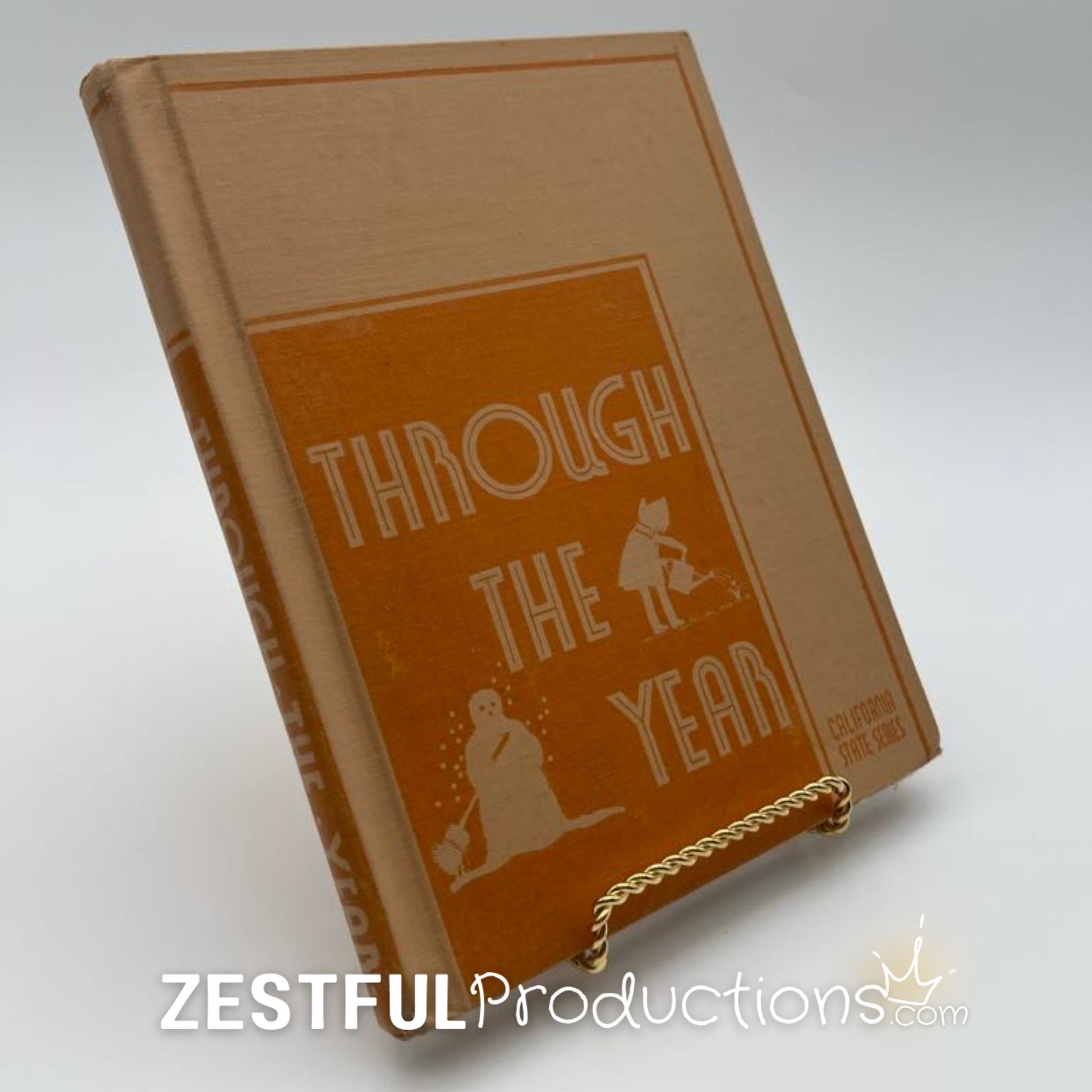 1944 Through the Year California State Series science reader hardcover textbook shown at an angle on display stand