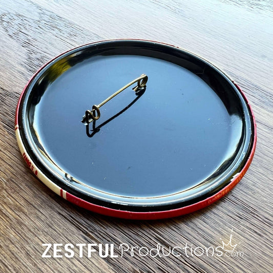 Side view of 1962 North Dakota Andrews for Governor campaign button showing celluloid pinback construction.