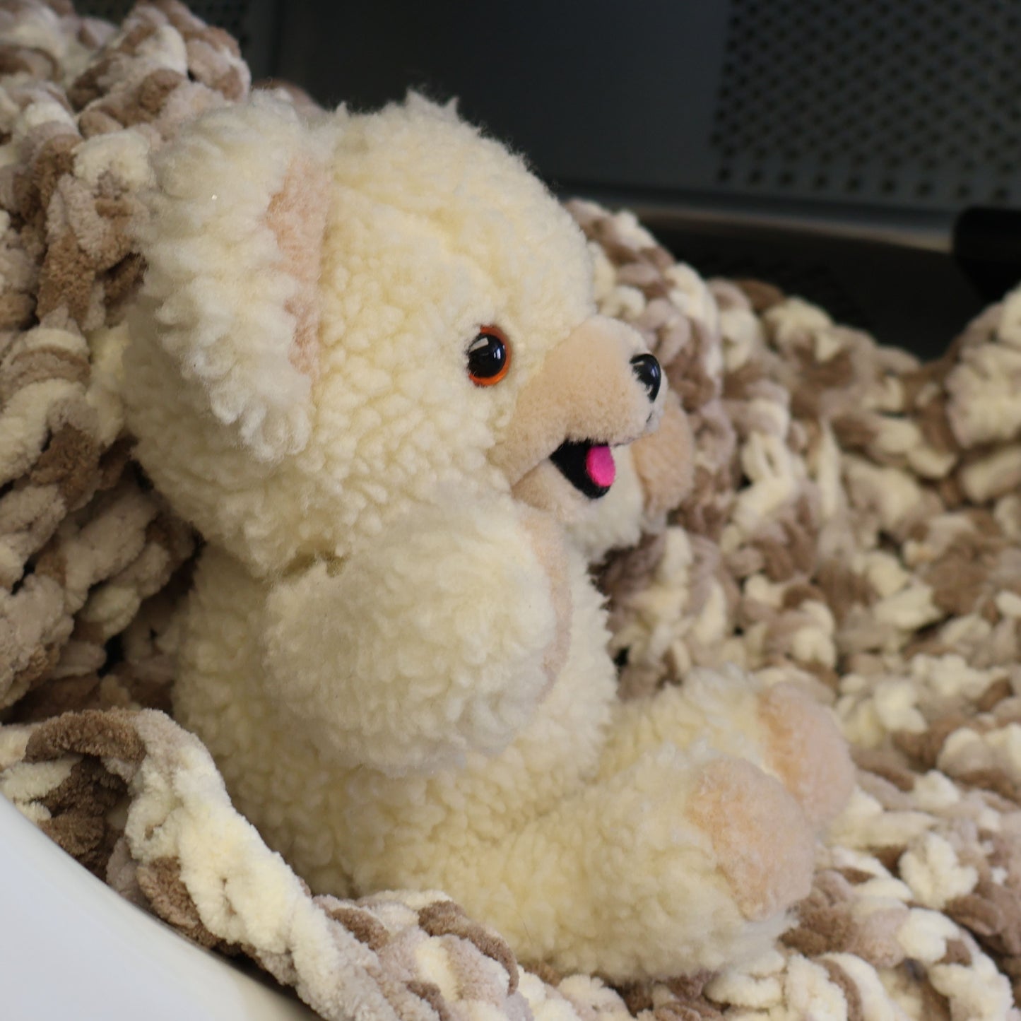 Side profile of an authentic 1986 Snuggle plush mascot highlighting its fluffy cream sherpa fabric, rounded ears, and friendly smile. A delightful vintage advertising collectible for collectors of retro toys and classic household brands.