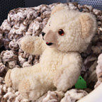 Profile photograph of the original Snuggle character plush highlighting fluffy cream fabric, rounded ears, bright brown eyes, and embroidered smile. This 1986 Lever Brothers collectible is ideal for retro decor, nostalgic displays, and advertising mascot enthusiasts.