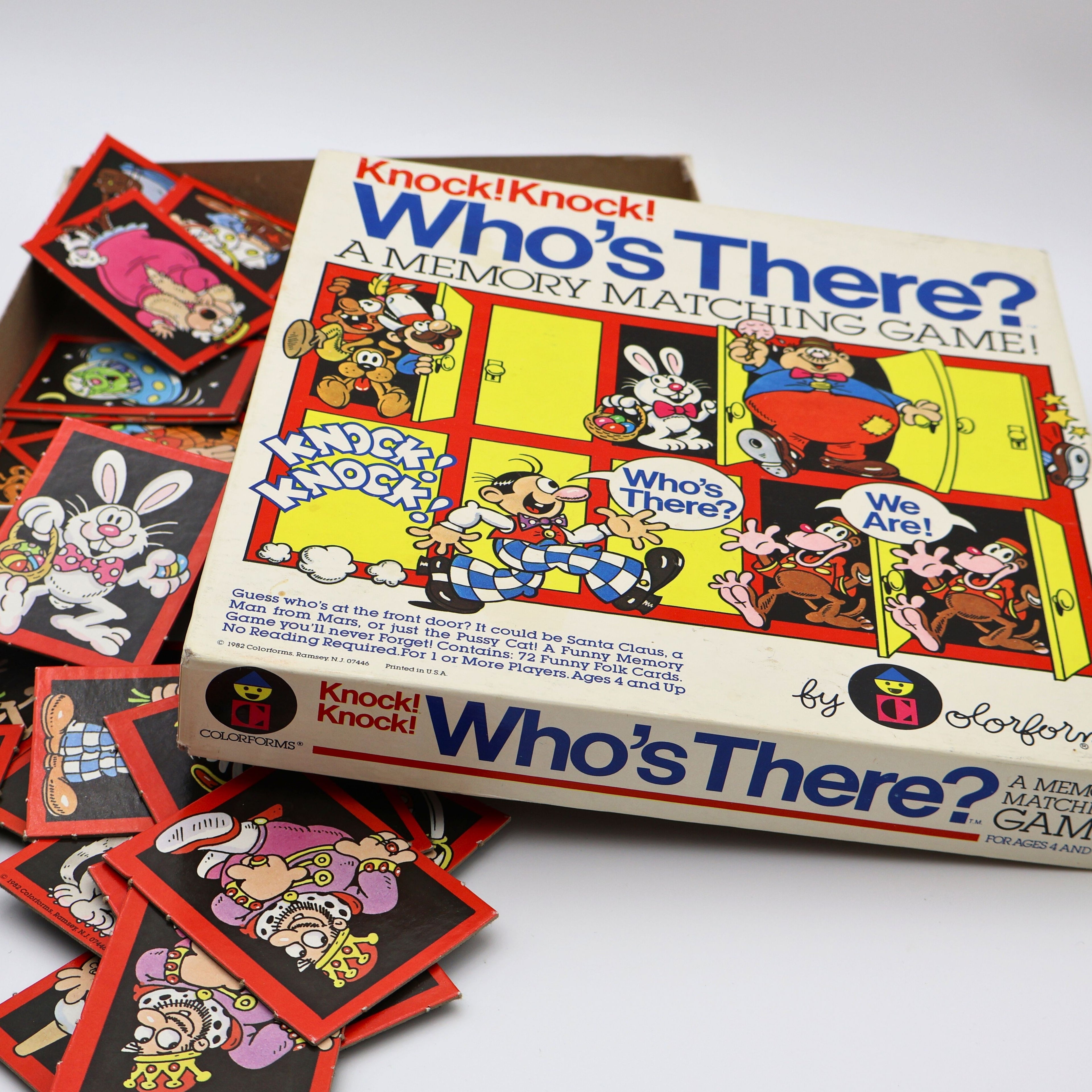 Close-up of 1982 Colorforms Knock Knock Who’s There memory matching game box featuring colorful cartoon door illustrations and retro typography.