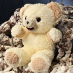 Angled view of an authentic 1997 Snuggle plush by Lever Brothers showing fluffy sherpa texture, embroidered smile, and classic seated pose. A wonderful collectible for vintage advertising enthusiasts, retro toy collectors, nursery shelf decor, or cozy cottage home styling.