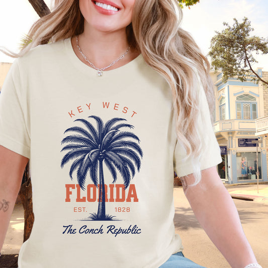 Woman wearing a 'Key West Florida' t-shirt with a palm tree graphic.