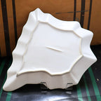 Backside of vintage Spain map ceramic serving tray showing sculptural country shaped form and glossy white finish, Mediterranean tapas platter underside, collectible European souvenir ceramic dish for display or entertaining