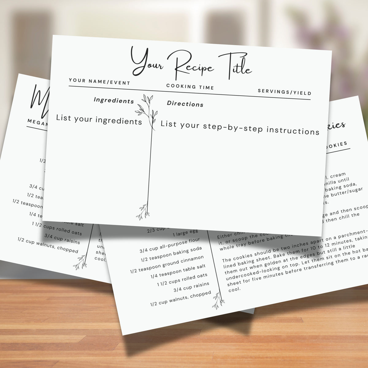 Two printable 4 x 6 inch botanical recipe cards displayed on a wooden kitchen counter. The horizontal template includes spaces for a recipe title, ingredients, directions, preparation time, cooking time and serving information.