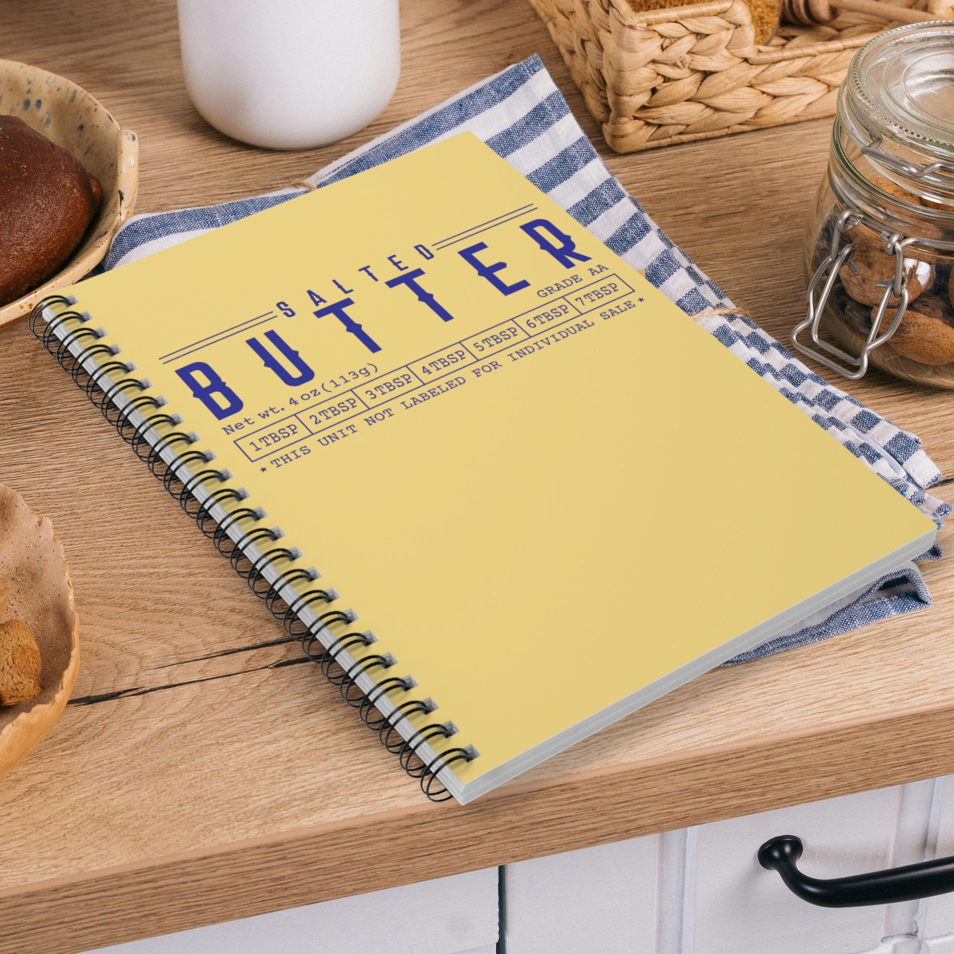 Butter notebook shown in flat lay with kitchen styling elements. Practical spiral journal for note taking, planning, and everyday use.