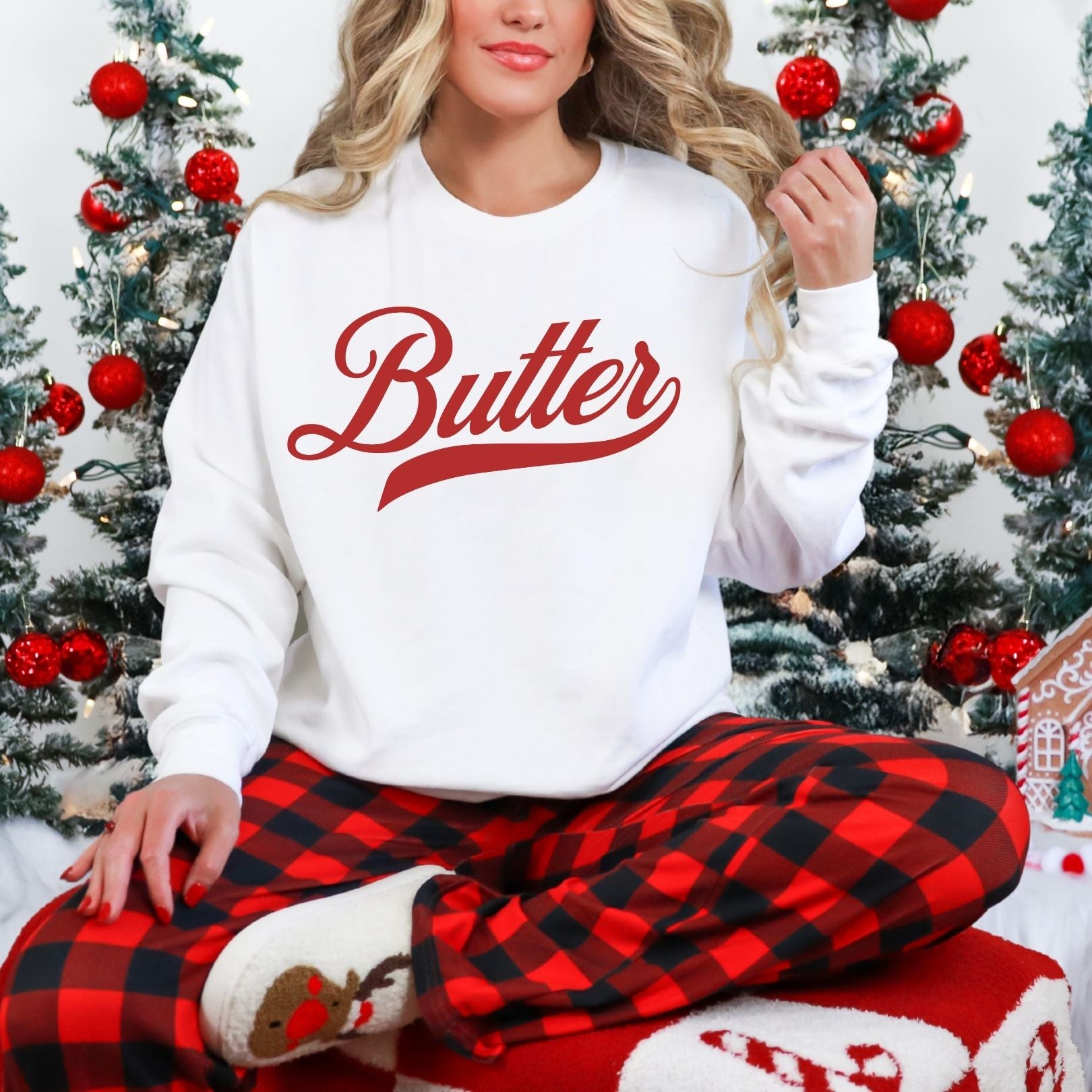 Butter script sweatshirt styled with festive plaid pants for cozy winter outfit. Vintage graphic crewneck perfect for holiday lounging, casual wear, and comfortable seasonal style.