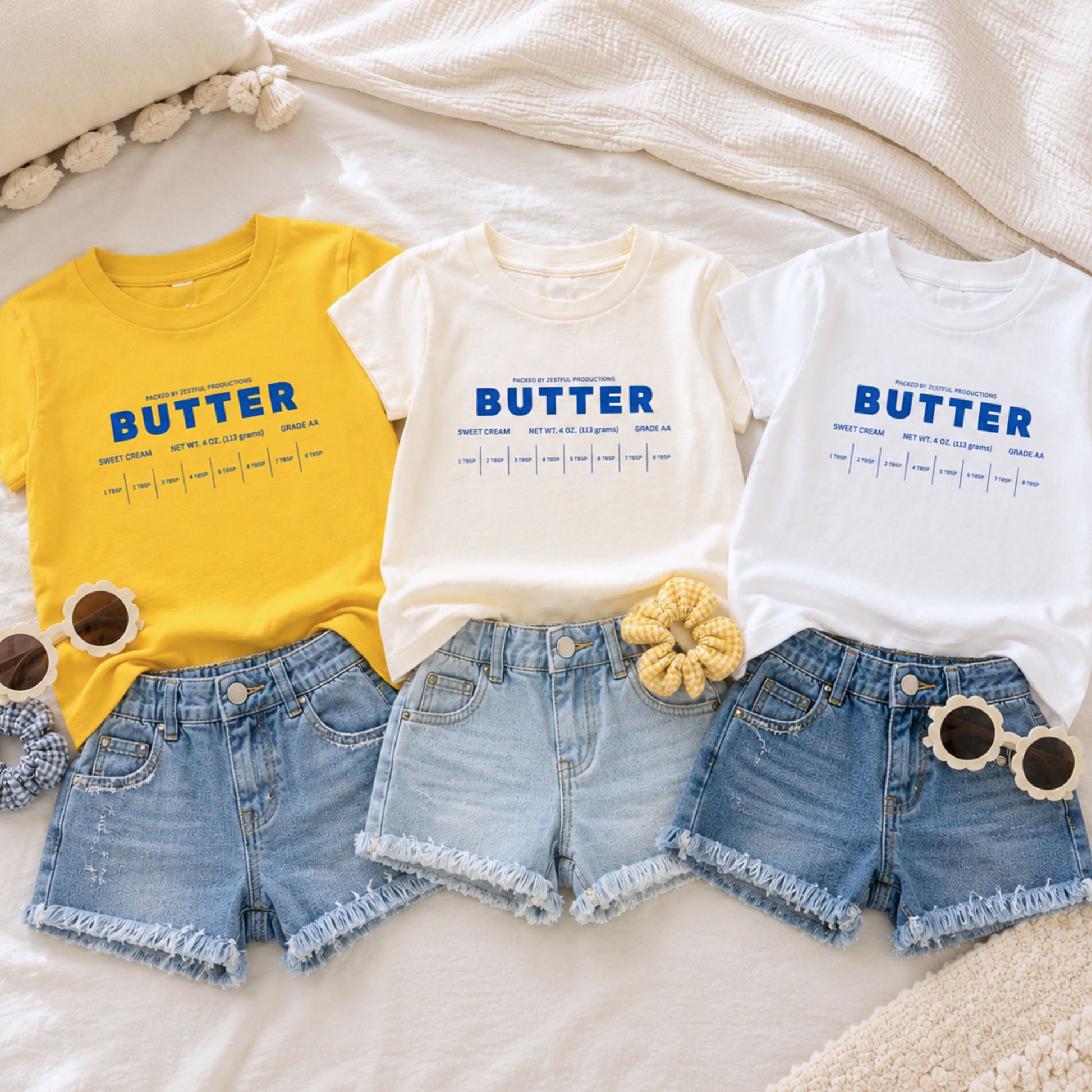 Butter toddler shirts in yellow white and cream color options styled with denim shorts for boutique kids fashion. Retro foodie toddler tees inspired by sweet cream baking themes, birthday outfits, and preschool apparel.