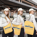 Butter tote bag features graphic showing durability, reusable design, and customization options. Functional and stylish everyday carry bag.
