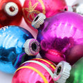 Colorful vintage Christmas ornament set featuring pink blue green and silver mercury glass baubles with retro Shiny Brite style finishes