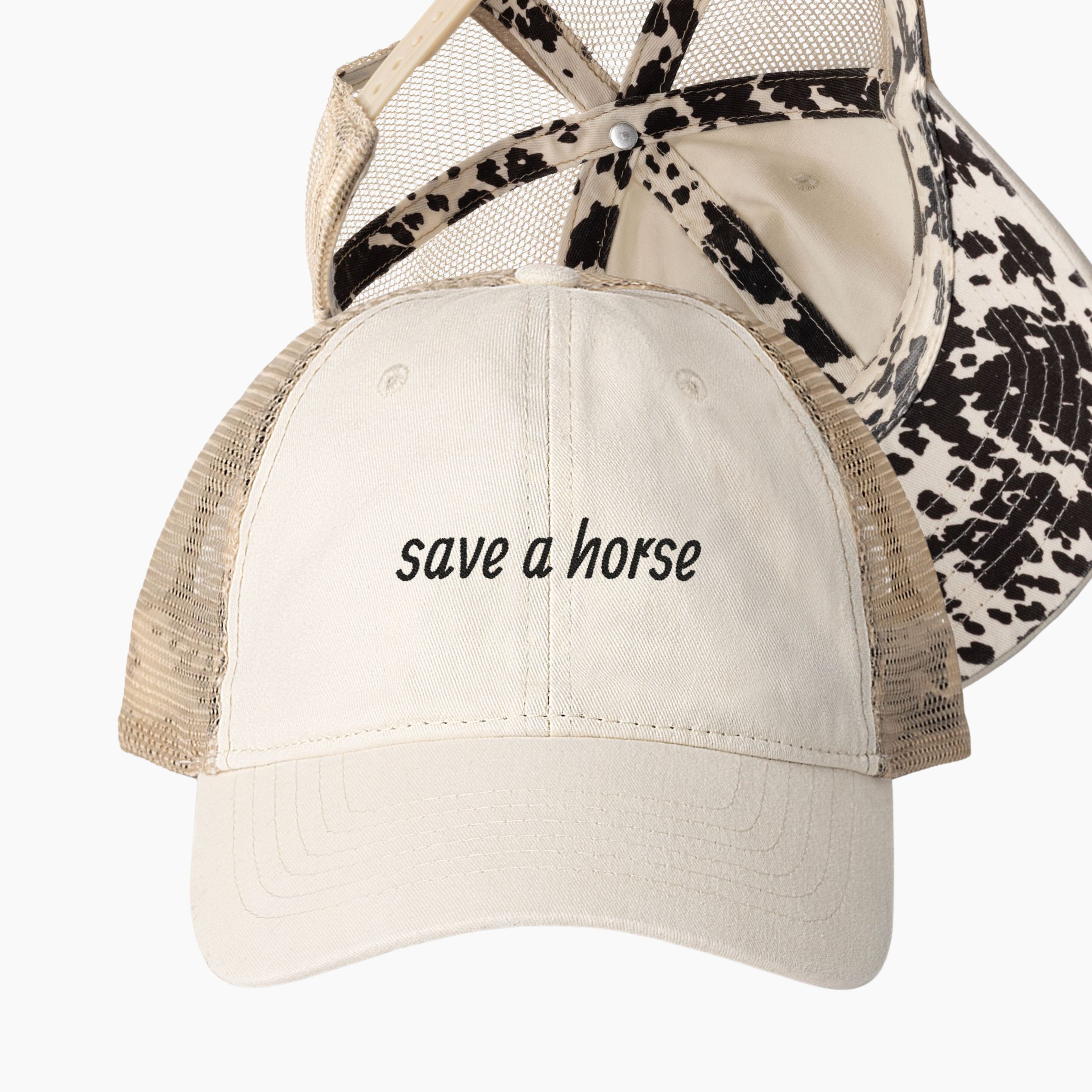Cream western ponytail trucker hat with save a horse embroidered phrase and cow print longhorn undervisor detail