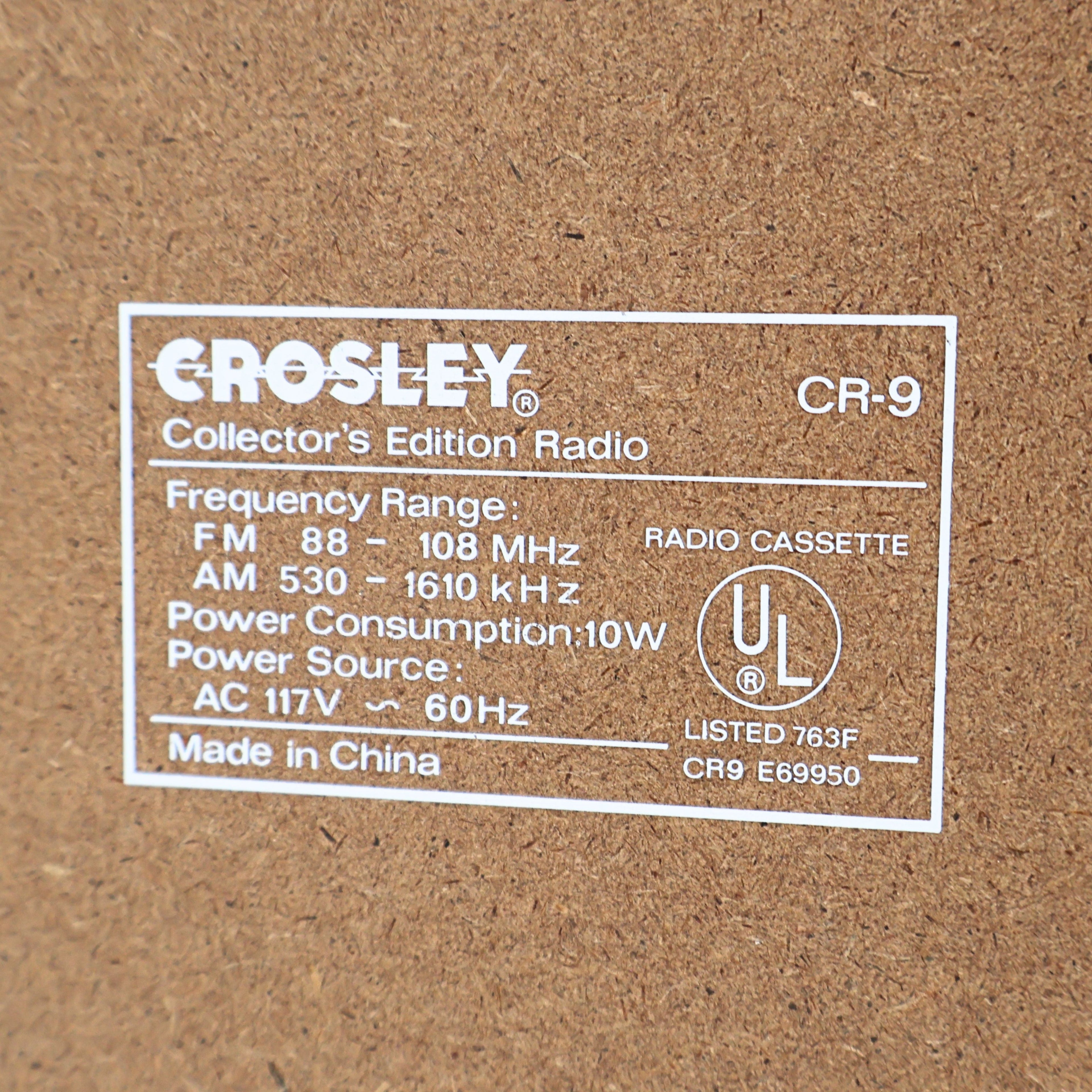 Back label of Crosley CR-9 jukebox radio showing model specifications, AM FM frequency range and cassette player details, vintage retro audio system with collector information