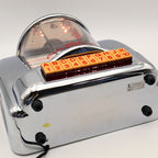 Full bottom view of Crosley CR-9 jukebox radio showing chrome base, rubber feet and underside construction, vintage inspired 1950s diner music player collectible