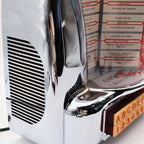 Side view detail of Crosley CR-9 jukebox radio chrome speaker grille and curved housing, retro 1950s diner inspired design with polished reflective finish