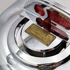 Top detail of Crosley CR-9 jukebox radio coin slot design and collector’s edition badge, retro diner inspired decorative feature with chrome and red accents
