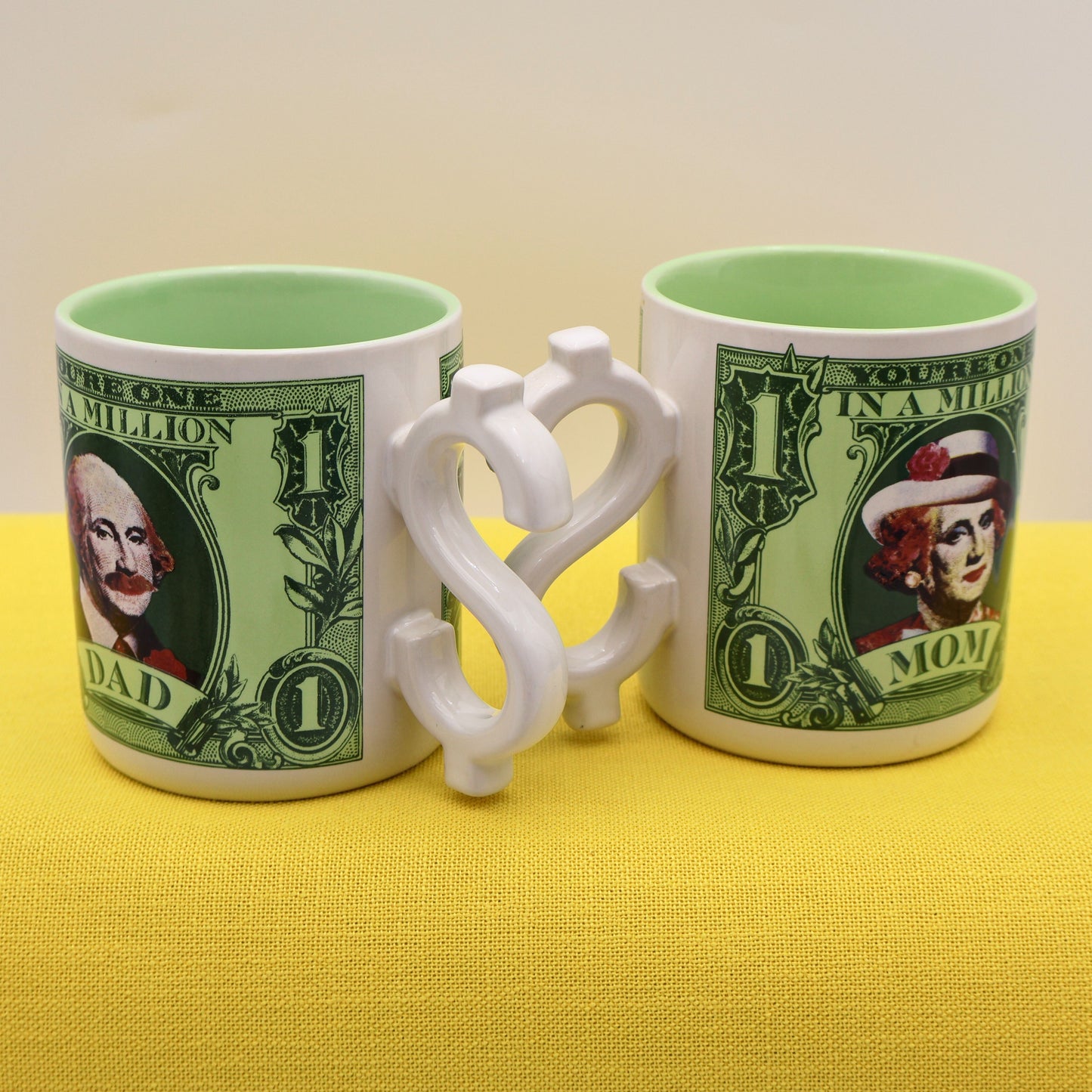 Side view of matching 1986 Enesco Mom and Dad coffee mugs with novelty handles