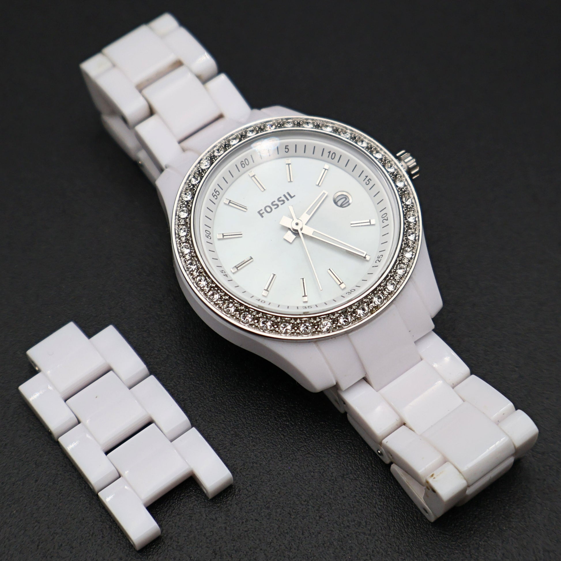 Fossil Stella Mini white women’s wristwatch with crystal accent bezel and white resin band angled display view