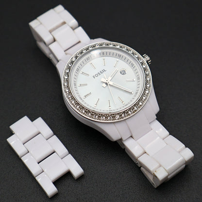 Fossil Stella Mini white women’s wristwatch with crystal accent bezel and white resin band angled display view