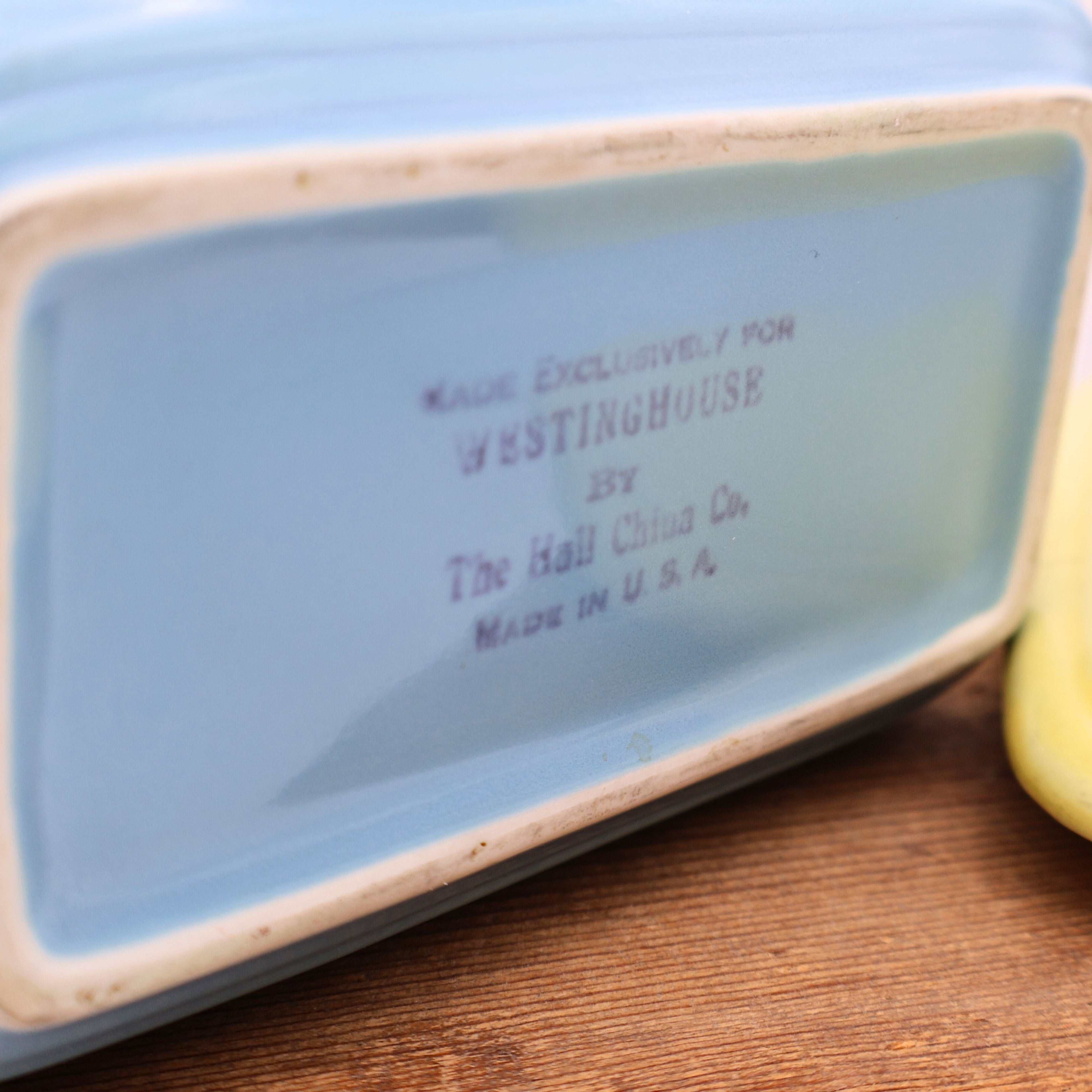 Hall China Company mark reading Made Exclusively for Westinghouse, Made in U.S.A., on vintage refrigerator dish.