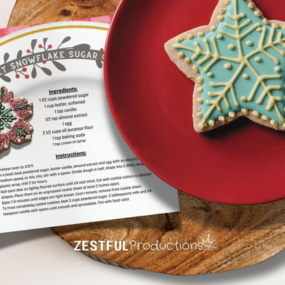 snowflake sugar cookie recipe with blue iced star cookie on red plate from kids holiday cookbook baking activity