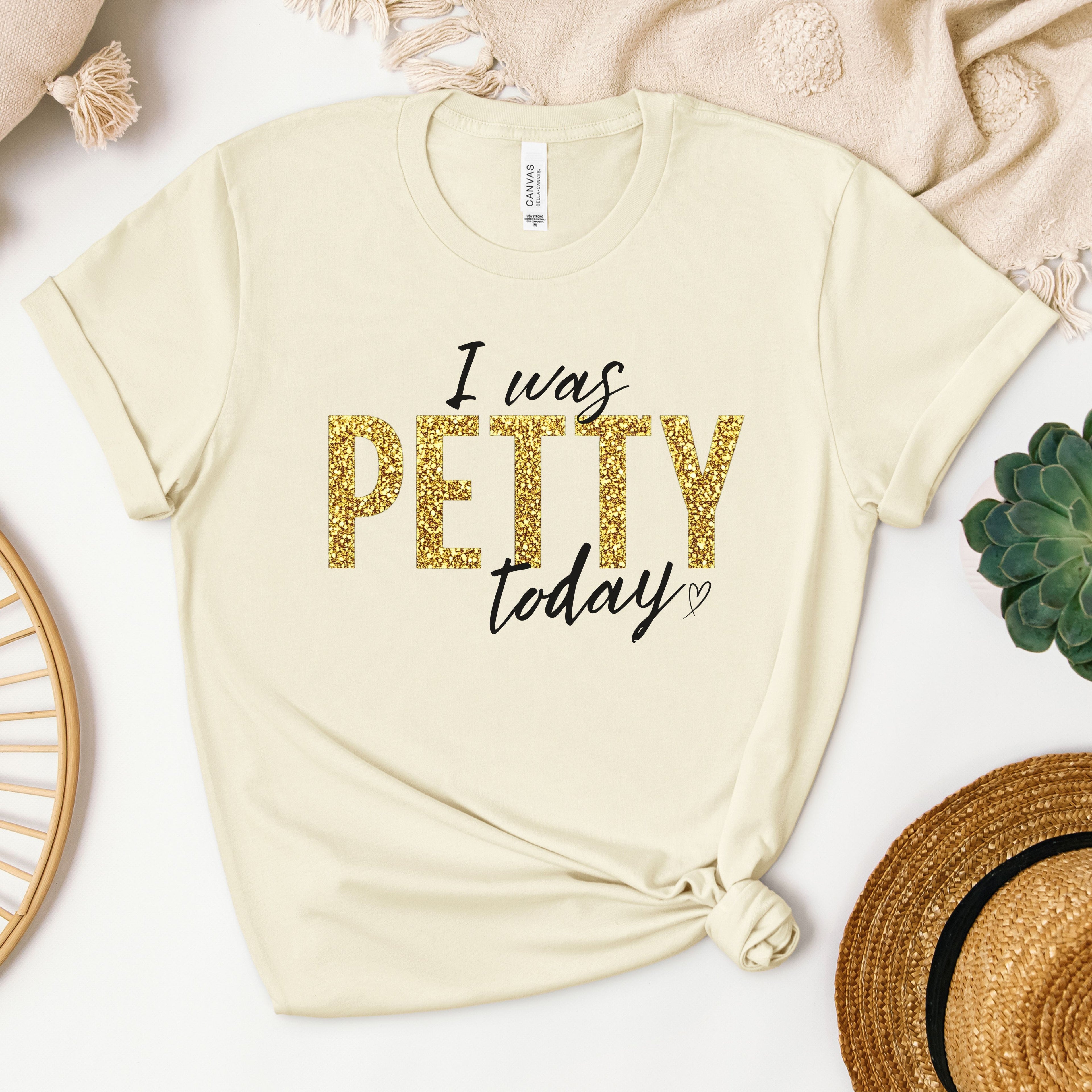 Cream t-shirt with gold faux glitter “I Was Petty Today” graphic design, soft neutral flat lay styling, cute sarcastic statement shirt for women, boutique aesthetic apparel