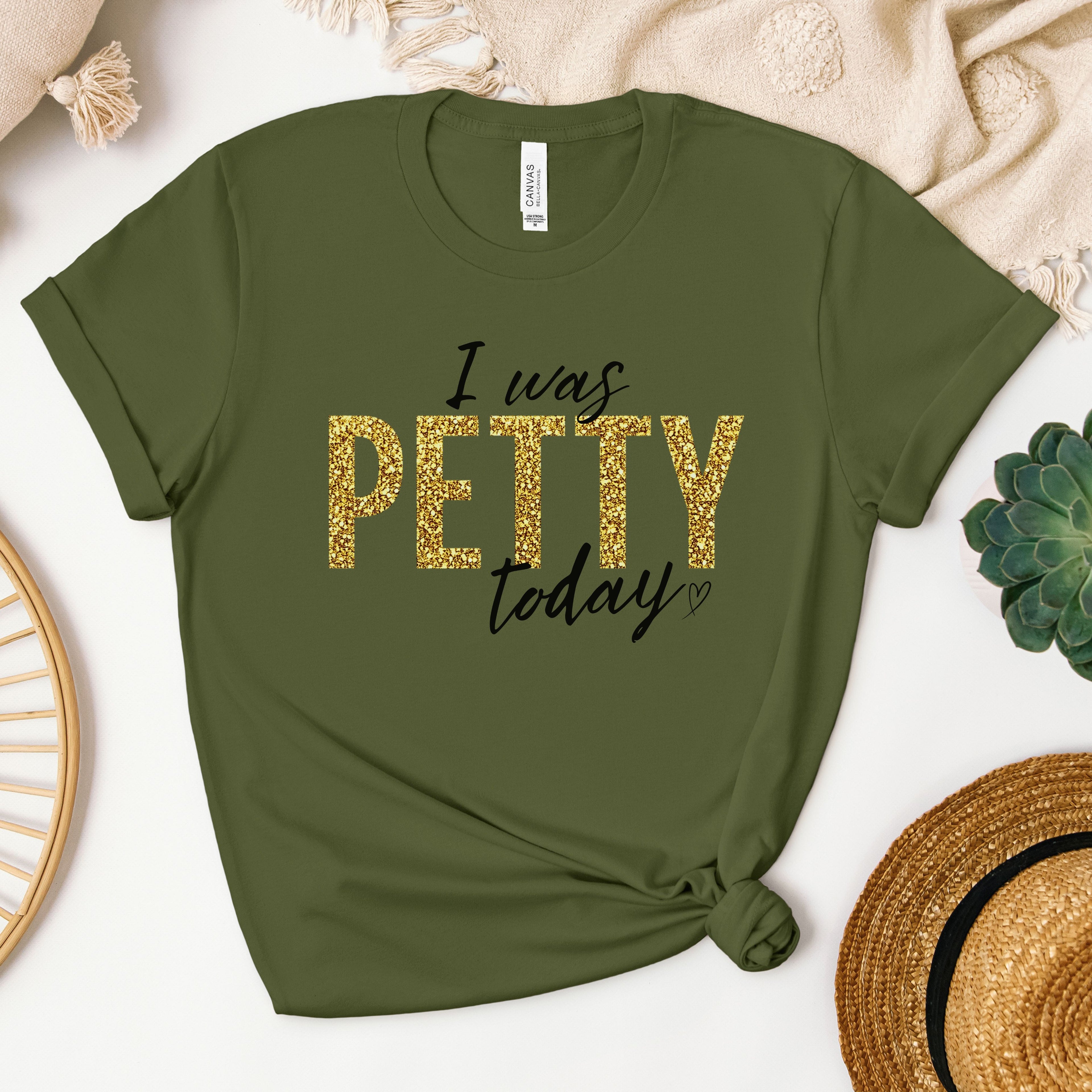 Olive green “I Was Petty Today” gold faux glitter graphic shirt, earthy tone flat lay mockup, bold sarcastic tee for women, casual everyday statement apparel