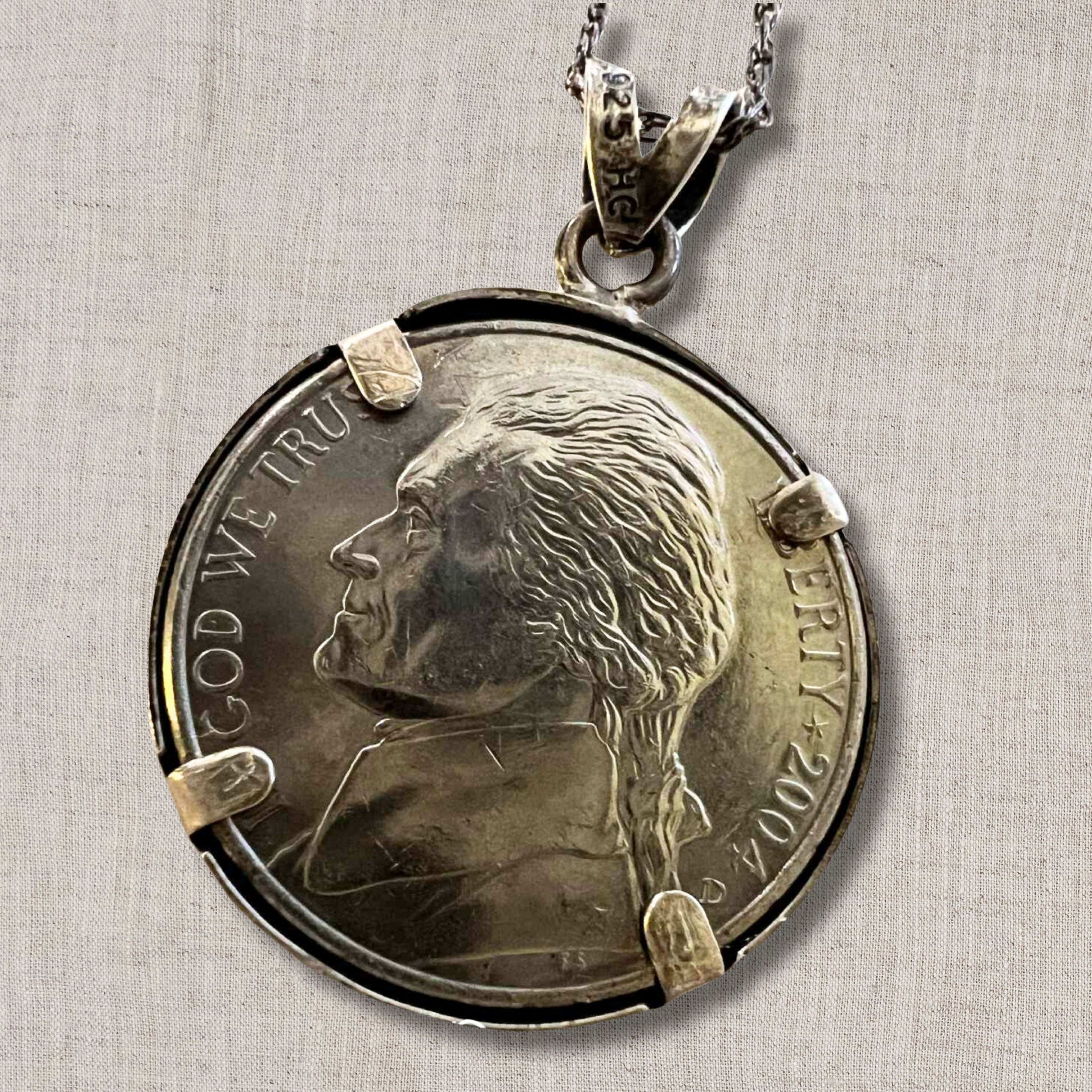 front view of 2004 Jefferson nickel coin pendant set in sterling silver, detailed portrait of Thomas Jefferson on authentic US currency necklace, vintage coin jewelry with bezel setting and natural wear, collectible Americana necklace