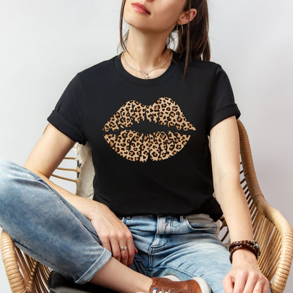 Woman wearing a black leopard kiss tee with leopard print lip graphic styled casually with jeans