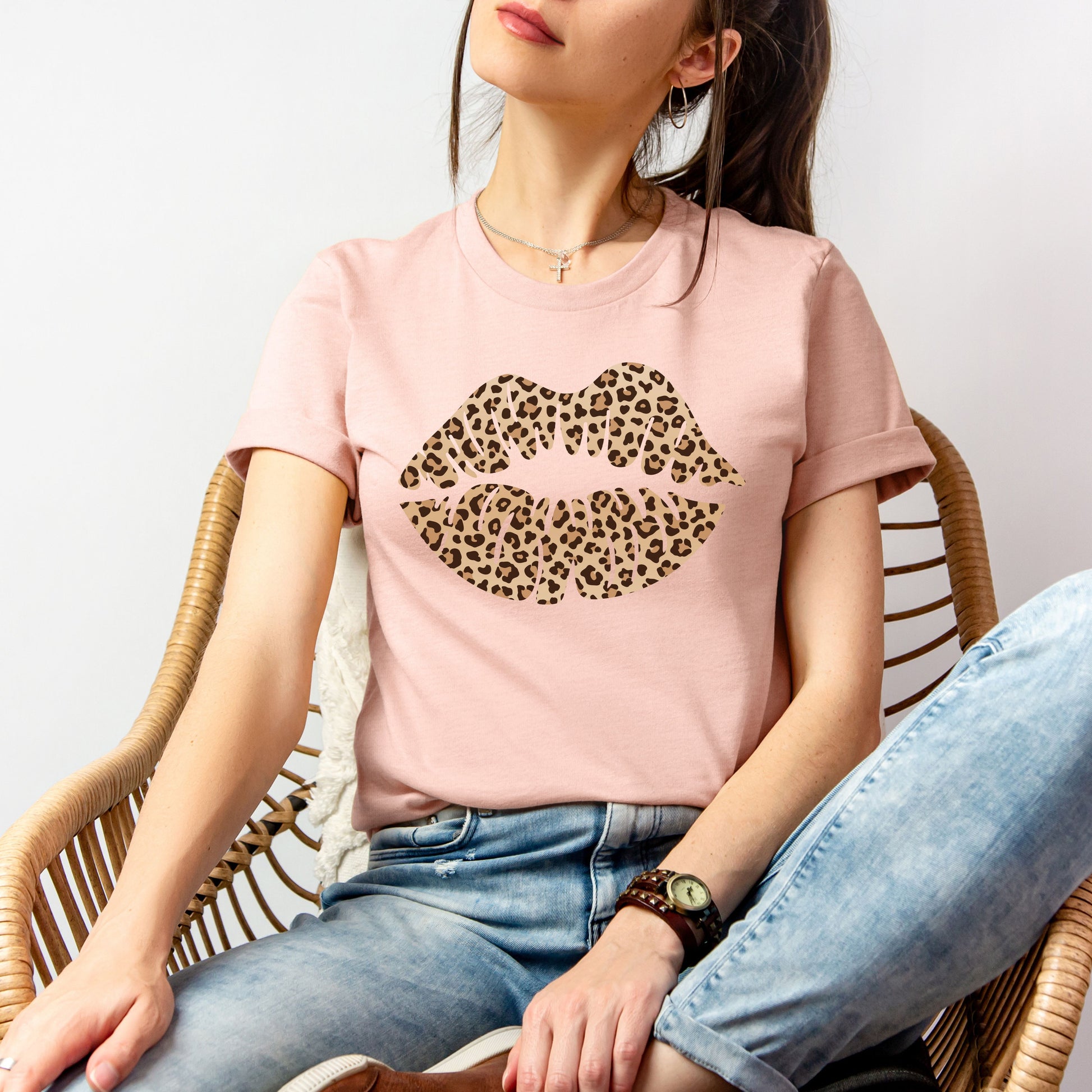 Woman wearing a blush leopard kiss tee with leopard print lip design styled for a casual outfit