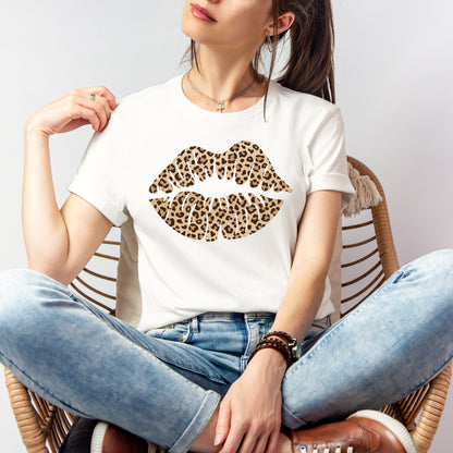 Woman wearing a white leopard kiss tee with leopard print lips graphic styled with denim