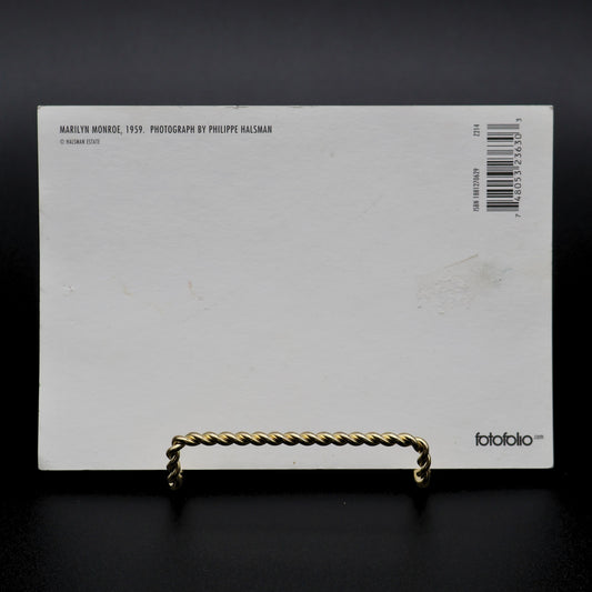 Back of Marilyn Monroe 1959 Jump postcard by Philippe Halsman showing Fotofolio publisher and ISBN