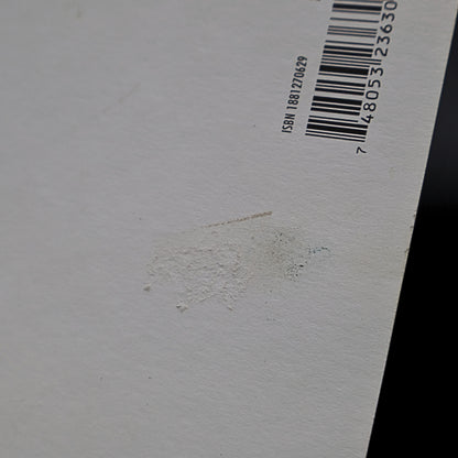 Detail of minor texture imperfection on back of Marilyn Monroe 1959 Jump postcard