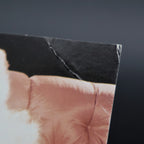 Close-up of corner bend damage on Marilyn Monroe 1957 Richard Avedon postcard