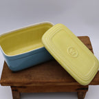 Mid century Hall China refrigerator dish with yellow interior and blue exterior, 1950s kitchen storage.