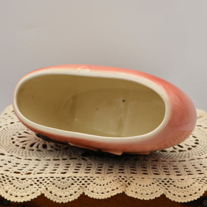 Top opening of vintage Royal Copley pink planter with oval shape and smooth cream rim.