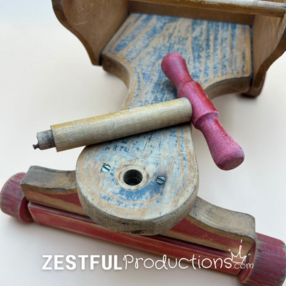 Detail of removable wooden handle on vintage doll push cart