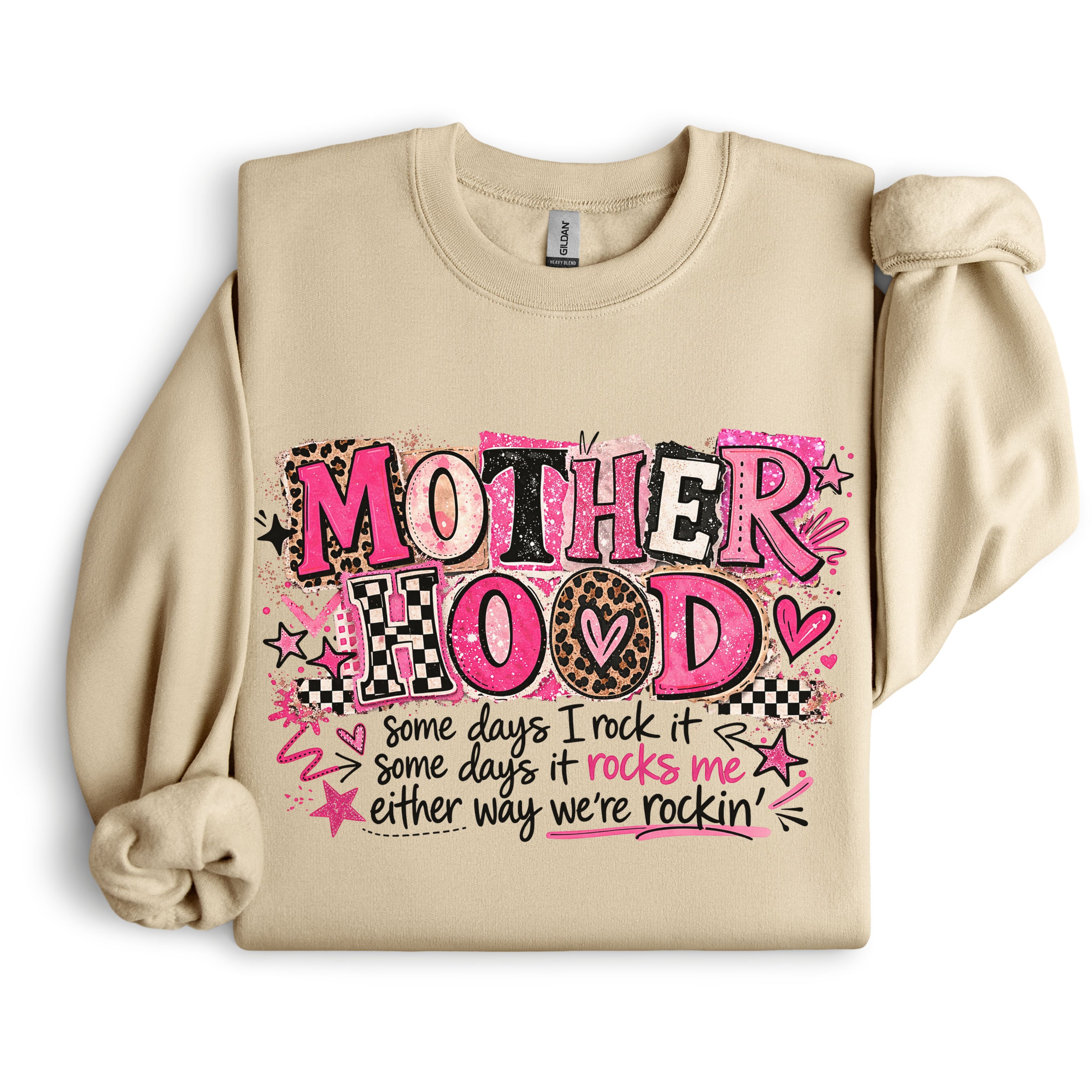 Sand colored Mother Hood graphic sweatshirt with pink boutique typography and funny motherhood quote displayed in flat lay mockup.