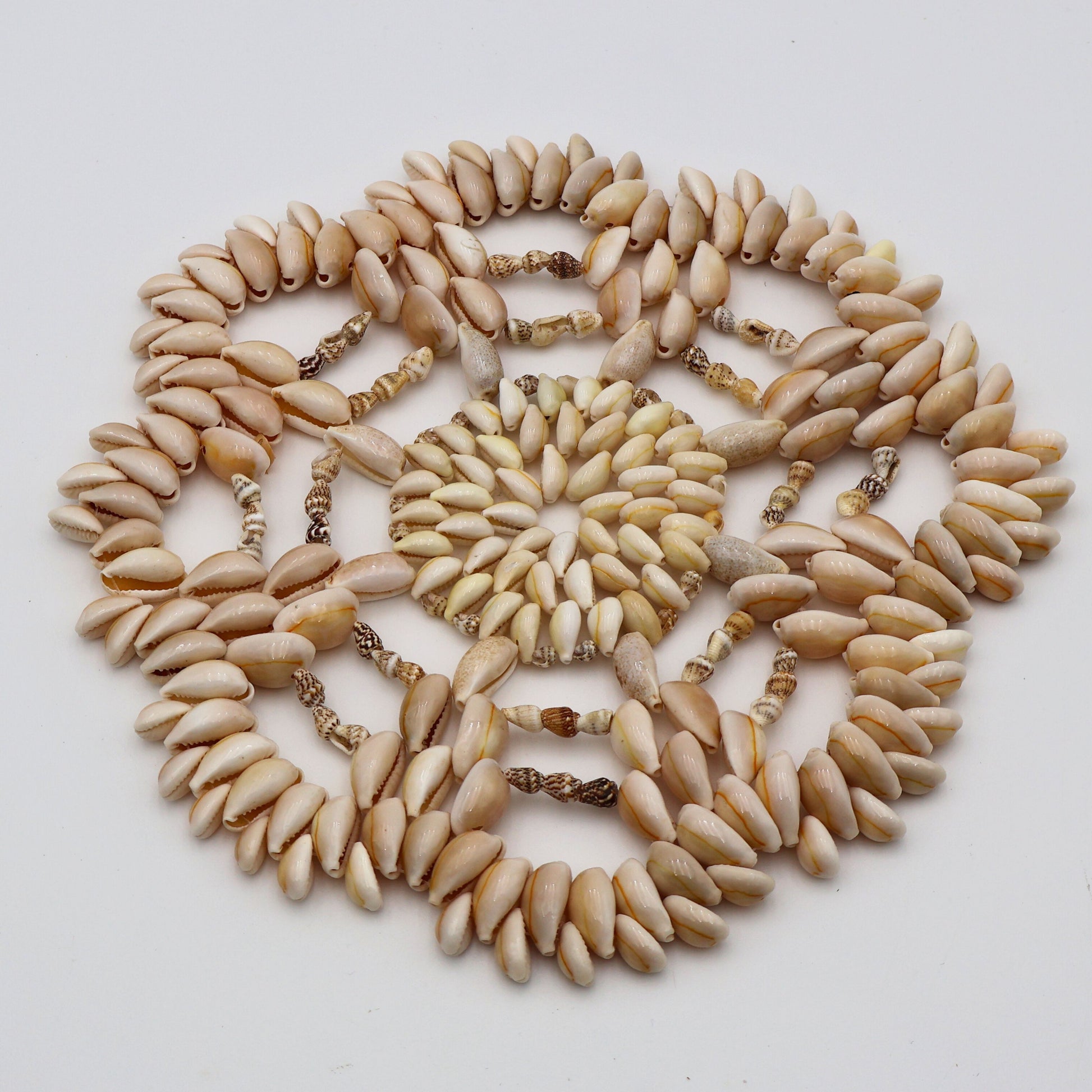 Vintage 1970s beach style seashell hot pad with textured layered design