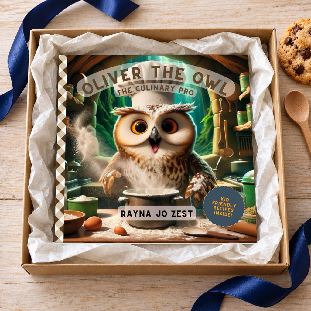 Oliver the Owl: The Culinary Pro paperback displayed in a kraft gift box surrounded by white tissue paper, with navy ribbon, a cookie and a wooden spoon on the table nearby.