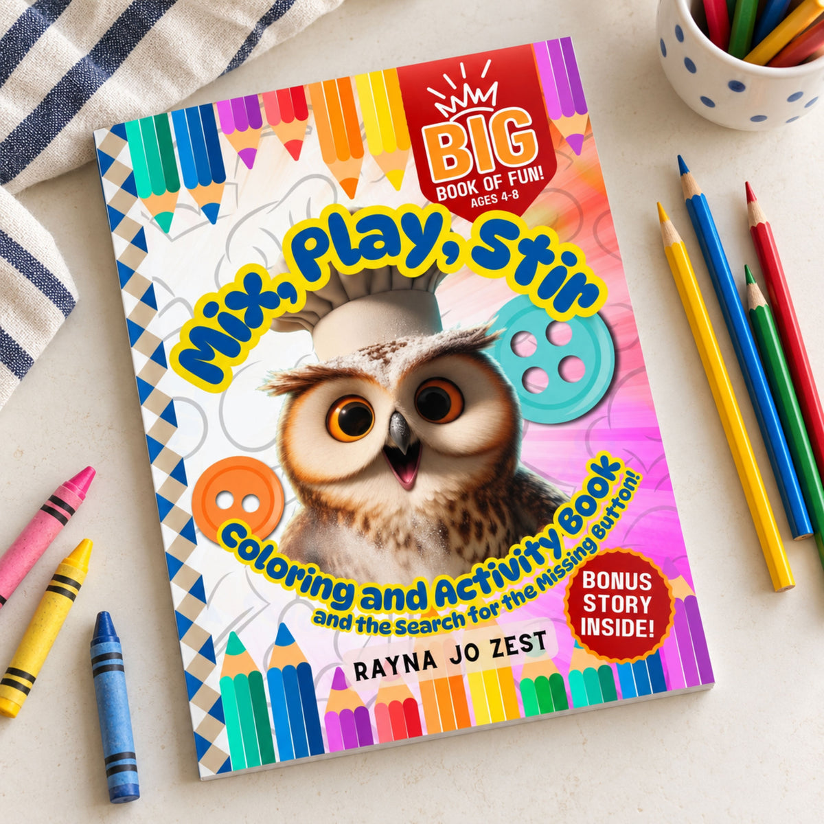 Mix, Play, Stir Oliver the Owl coloring and activity book on a light tabletop beside colored pencils, crayons, and a striped cloth.
