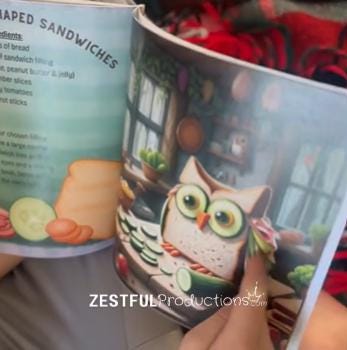 hands flipping through Oliver the Owl children’s cookbook showing story pages and kid-friendly recipes