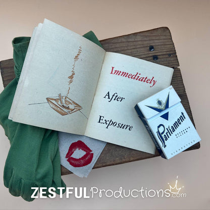 Curated WWII military ephemera vignette with gloves and cigarette box