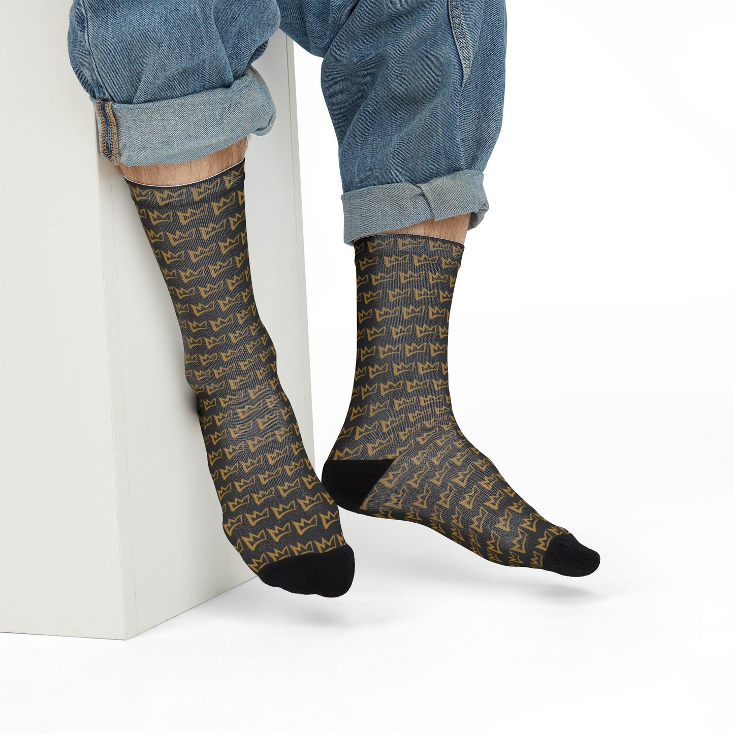 Gold and black Zesty crown patterned crew socks shown mid-calf on model
